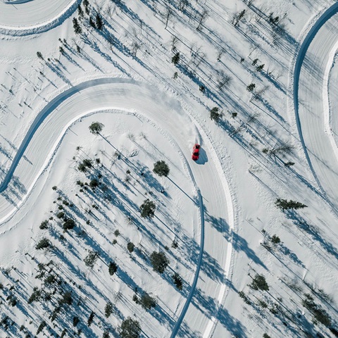 Birds view on snowy landscape with preparated racte track