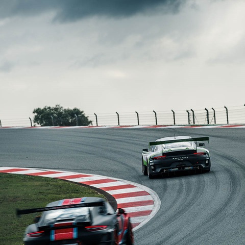 Two Porsche GT on race track