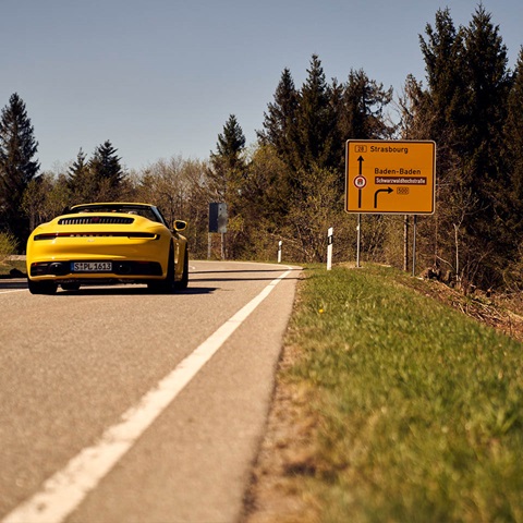 Porsche Cabriolet is driving on the road to Straßburg