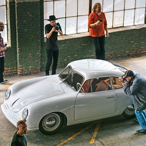 Light grey Porsche 356 at event, being photographed