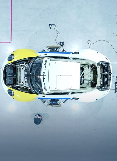 Drone shot of sports car being wrapped