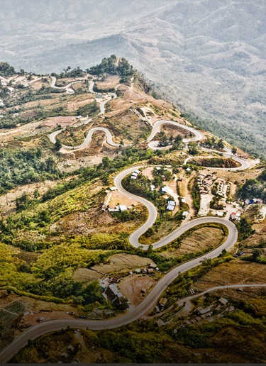 Winding roads in the remote green mountains of Nan, Thailand