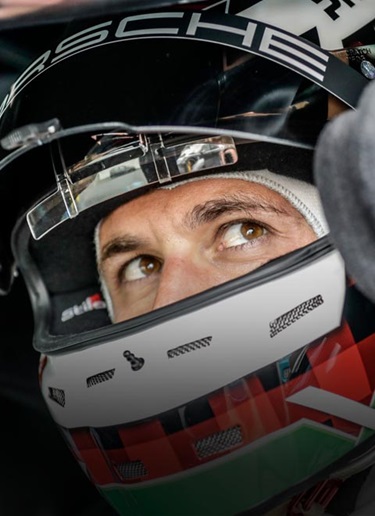 Close-up of Lars Kern Porsche test driver in helmet