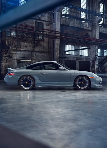 Side profile of Porsche 911 Classic Club Coupe in warehouse
